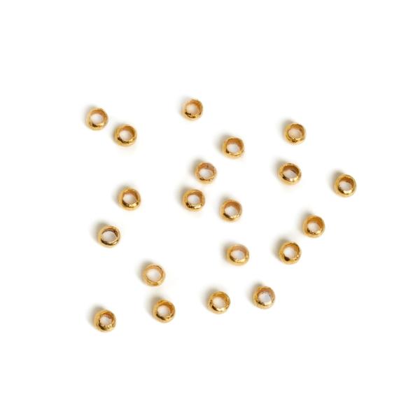 Nagy lyuk� gy�ngy 1,5x1 mm arany 20 db