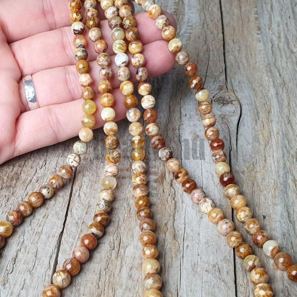 koralky-z-mineralu-opal-hnedy-6mm-leskle-hladke-nebrusene-zlte-hnede-zelenozlte-goralky-