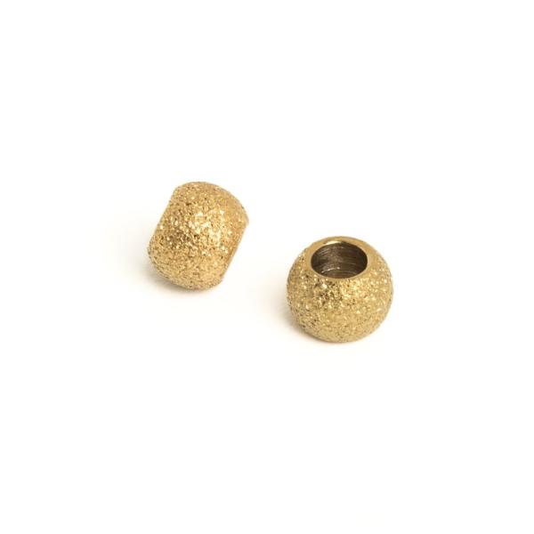 Homokf�vott hat�s� gy�ngy 4x3 mm arany nemesac�l 2 db (ion plating)
